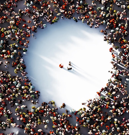 sc-cs-clydesdalebank-hero Three people stood in the middle of a large circle of people